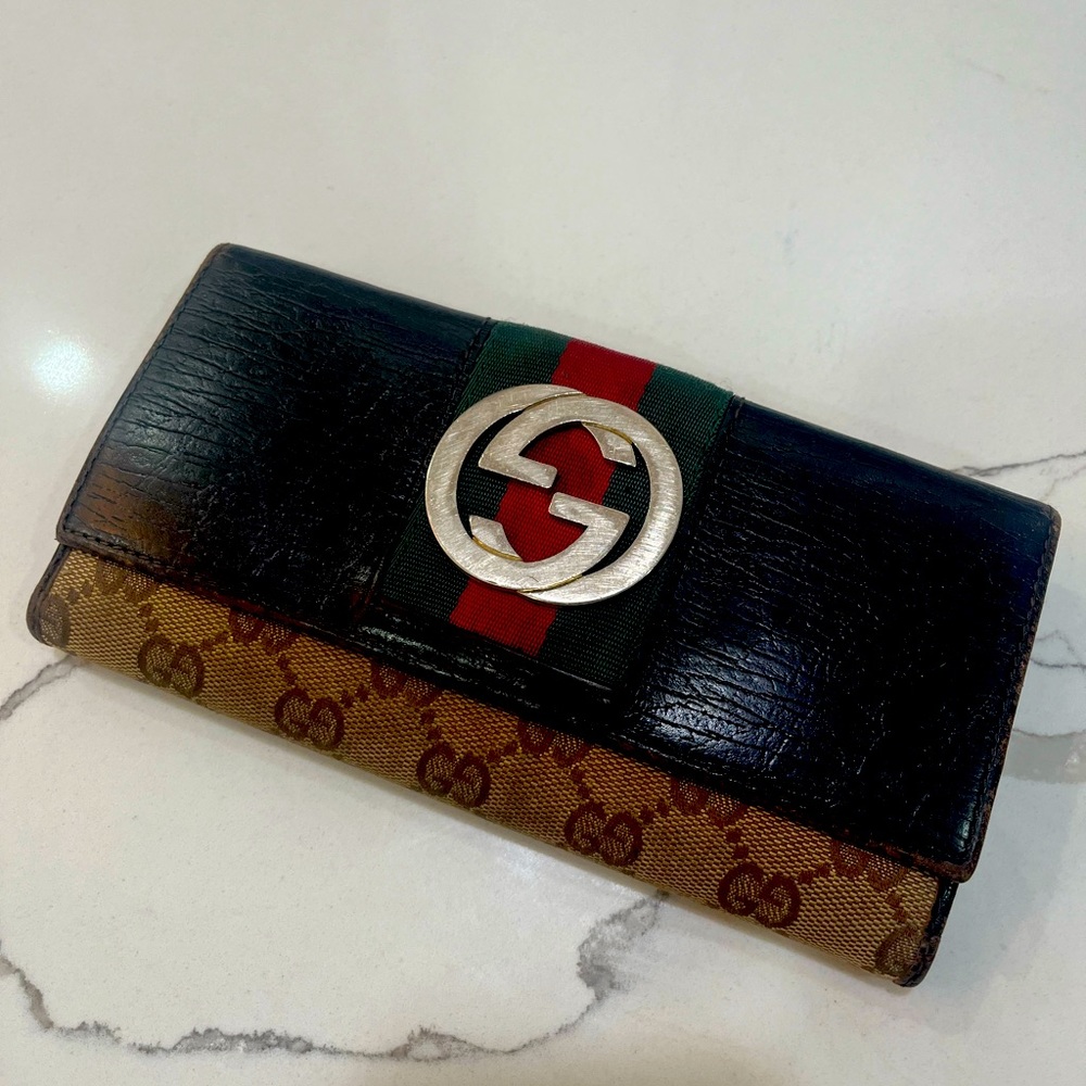 Monogram Gucci wallet with Gold